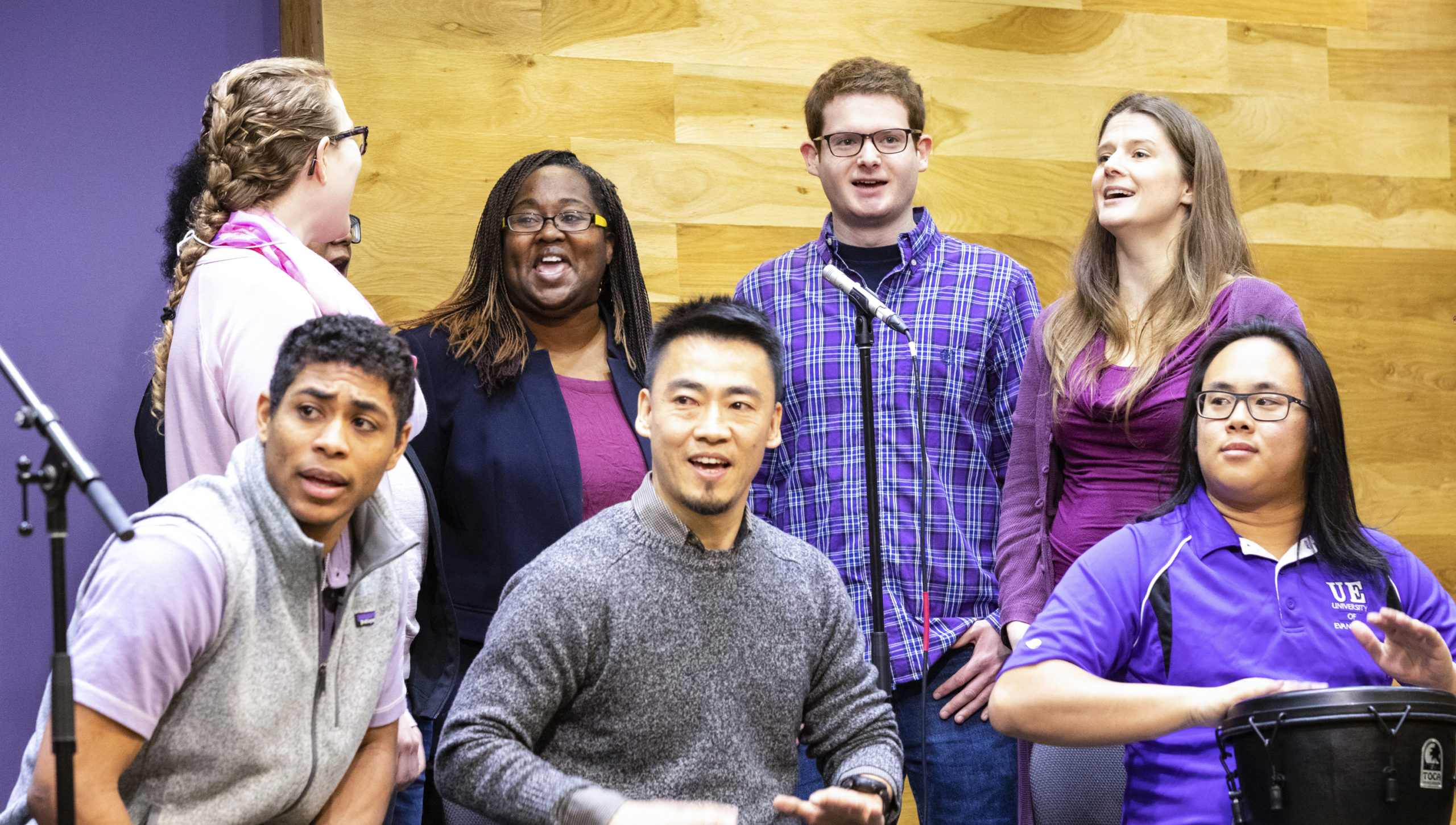 international students singing in chapel